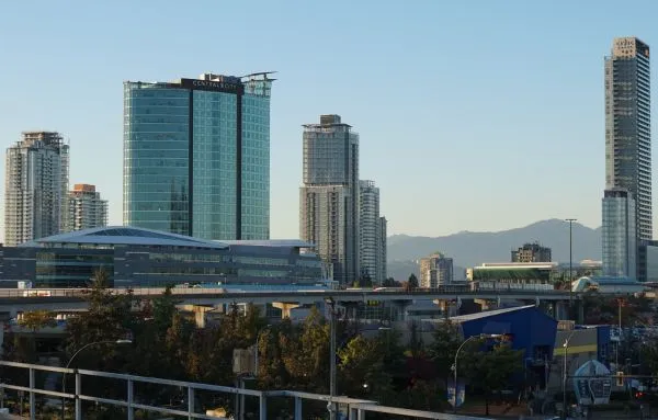 a-view-of-the-surrey-city-skyline-with-tall-buildings-and-a-monorail-joel-janitorial-cleaning-services-inc